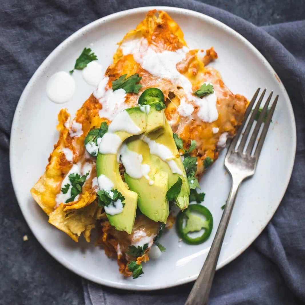 Black Bean Chicken Enchiladas with Pumpkin Sour Cream Sauce Whisk